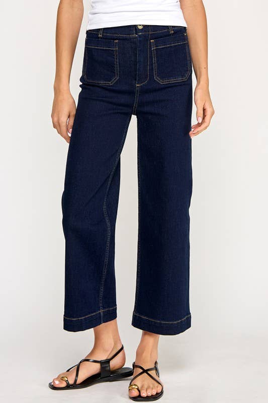 High waist cropped wide-leg jeans in stretch denim with clean front pockets, styled with sandals and blouse.