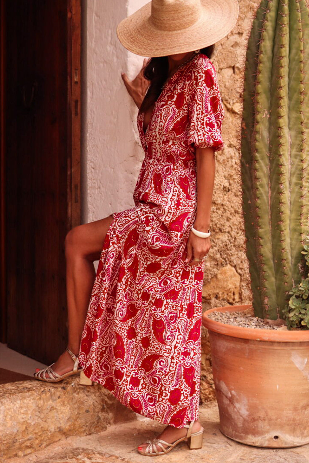 Red paisley print maxi dress with side slit, puff sleeves, high waist, and V-neckline.